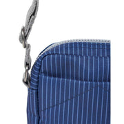 roka-bond-small-recycled-canvas-crossbody-bag---dark-denim-pinstripe-blue-34459959